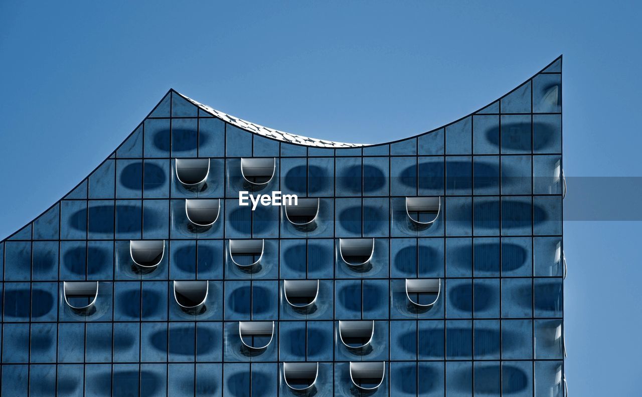 Modern building against clear blue sky