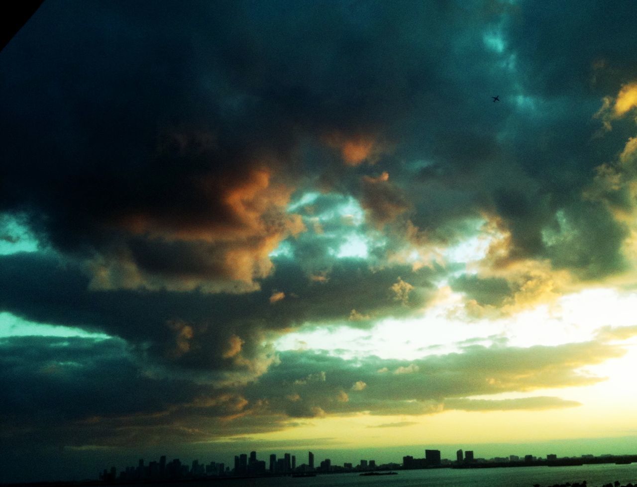 SCENIC VIEW OF LANDSCAPE AGAINST CLOUDY SKY AT SUNSET