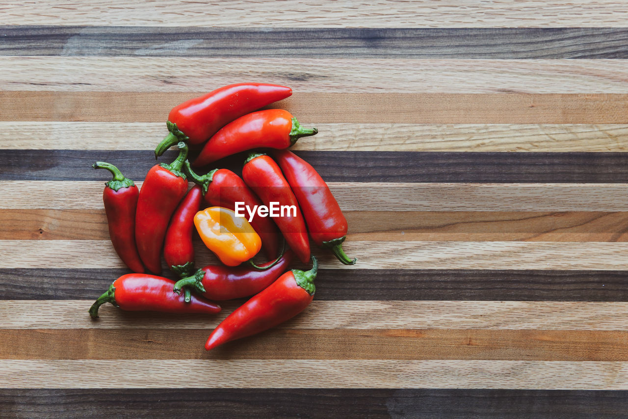 High angle view of red chili peppers on table