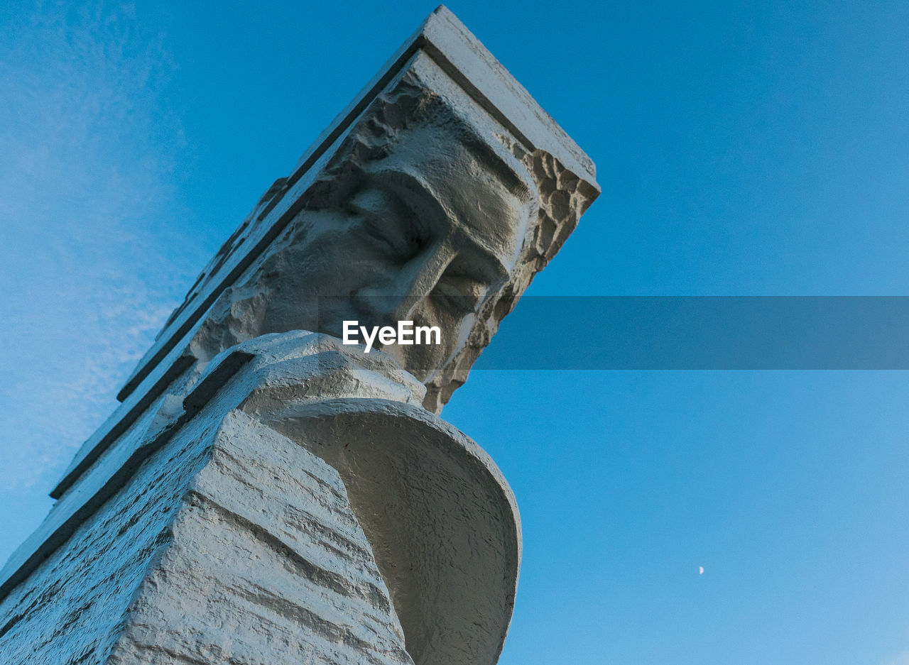 Low angle view of tower against clear blue sky