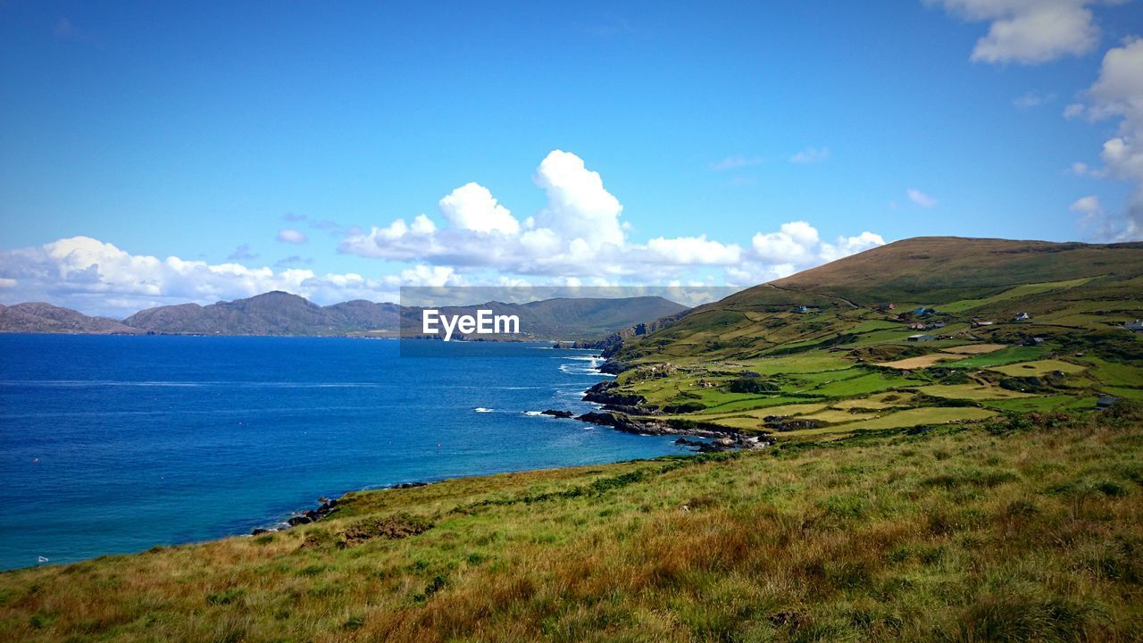 Scenic view of landscape against cloudy sky