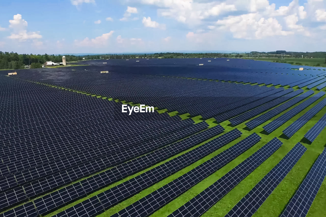 High angle view of solar panel on field against sky