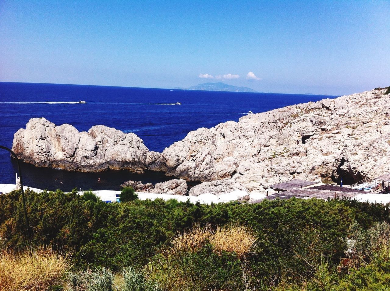 SCENIC VIEW OF SEA WITH ROCKS IN BACKGROUND