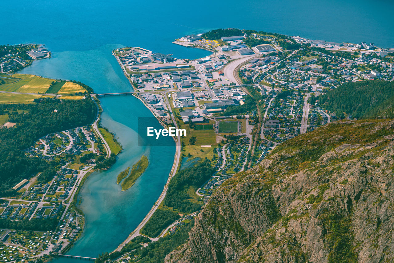 Aerial view of cityscape by sea