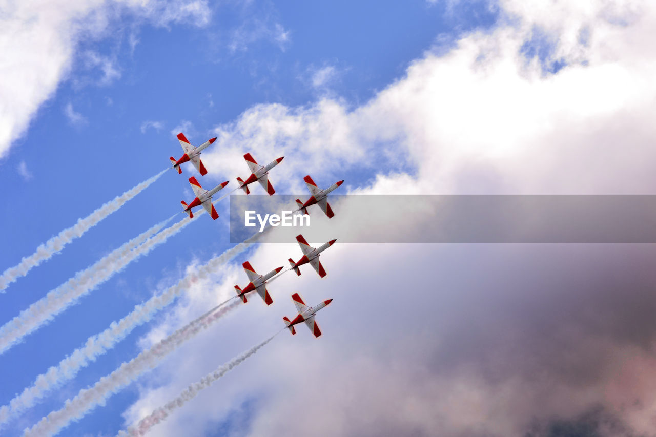 LOW ANGLE VIEW OF AIRSHOW IN SKY