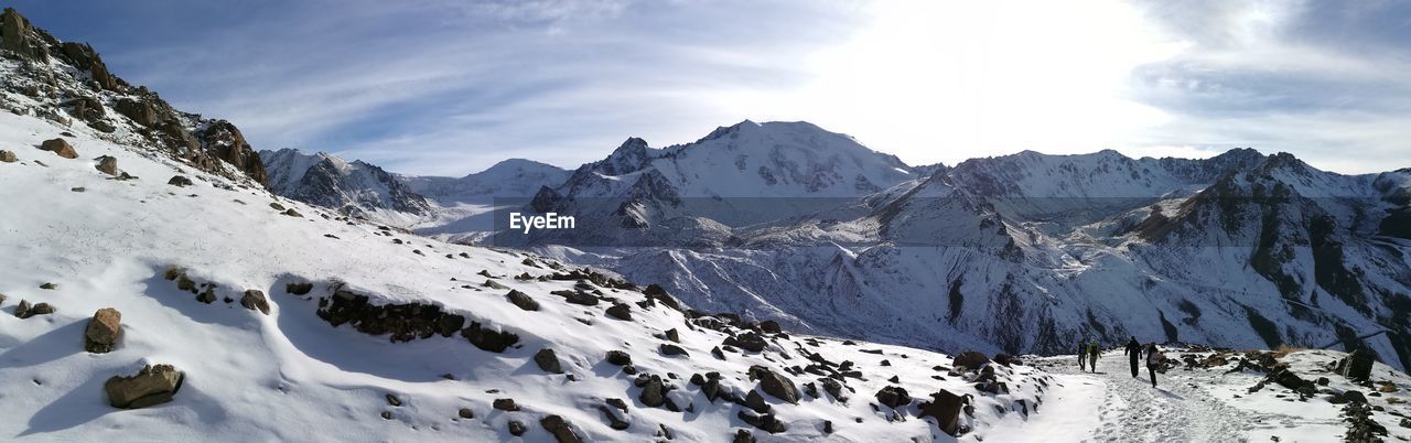 Panoramic view of snowcapped mountains against sky