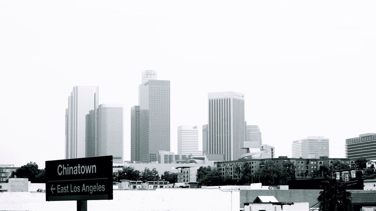 Buildings in distance against clear sky