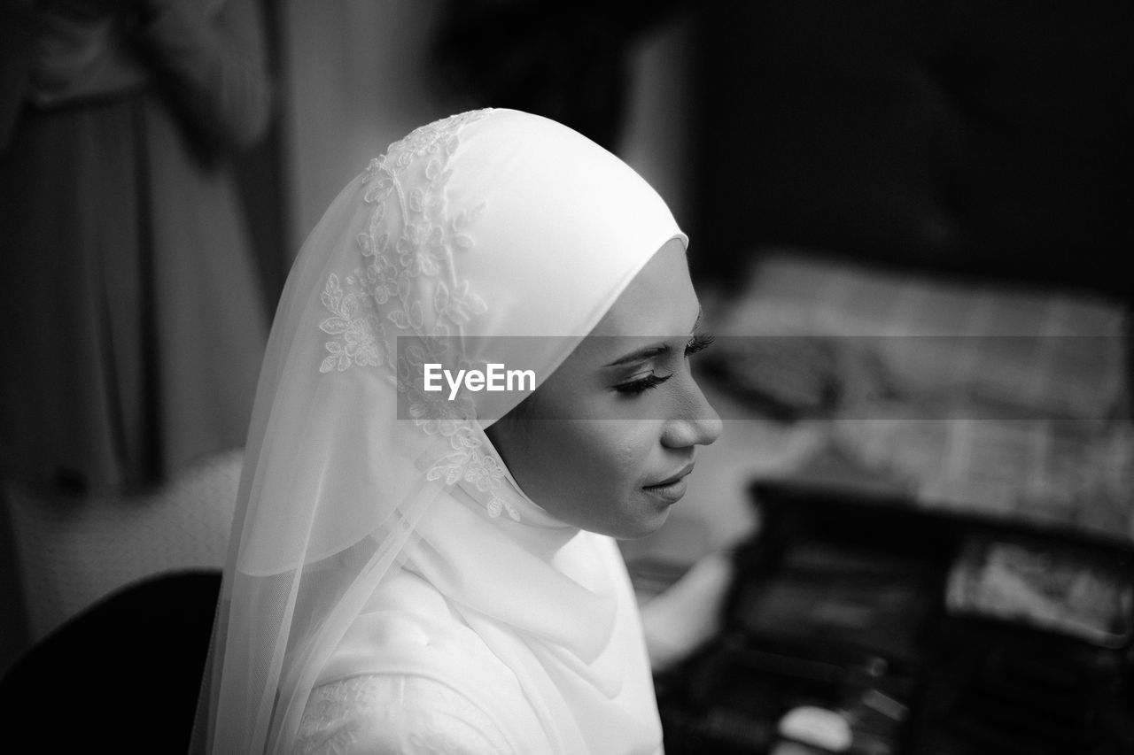 Close-up of young woman wearing mask