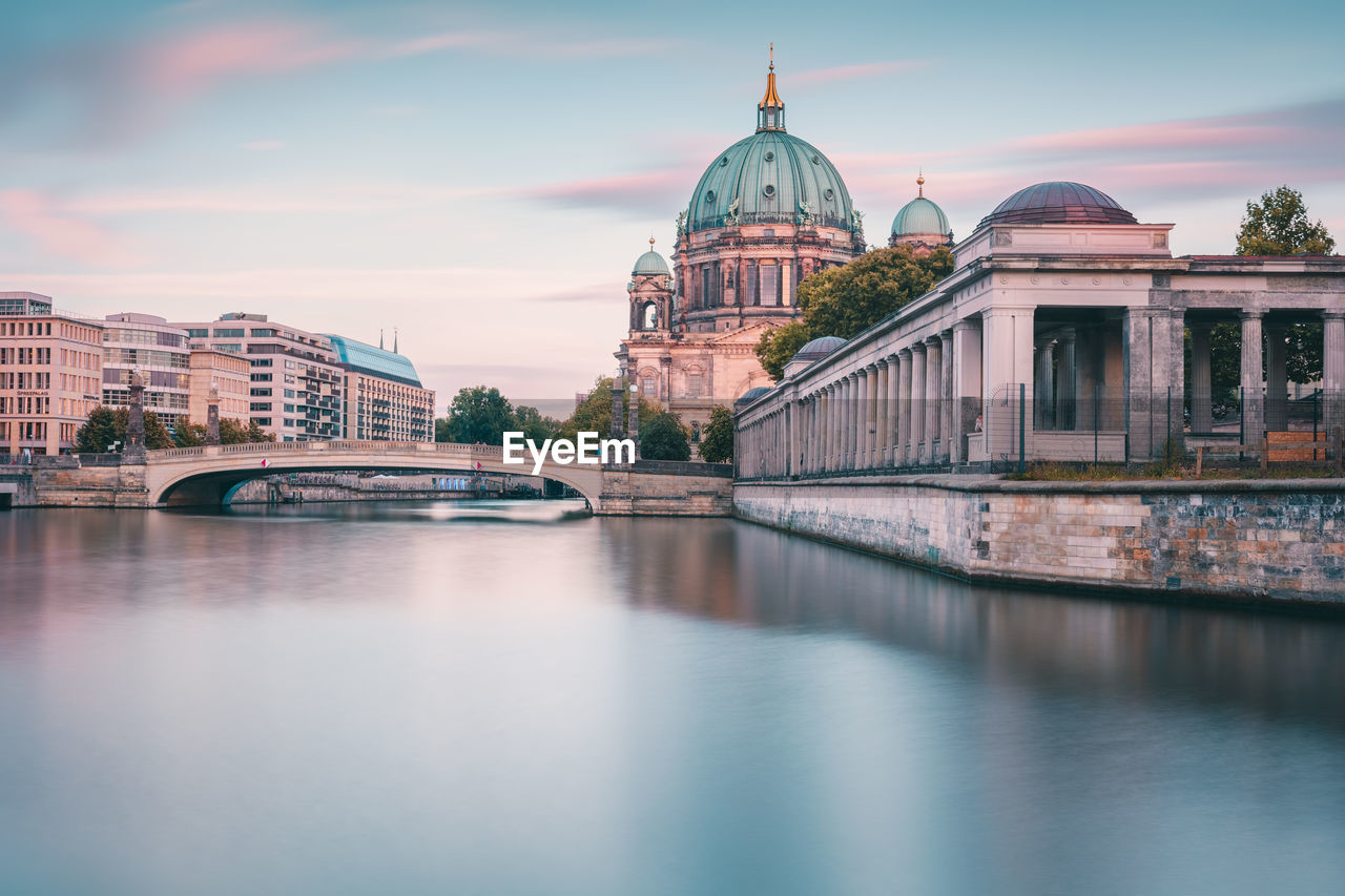 River by berlin cathedral against sky