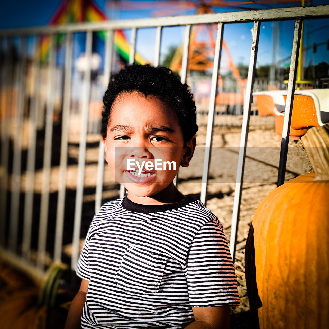 Portrait of boy standing at playground