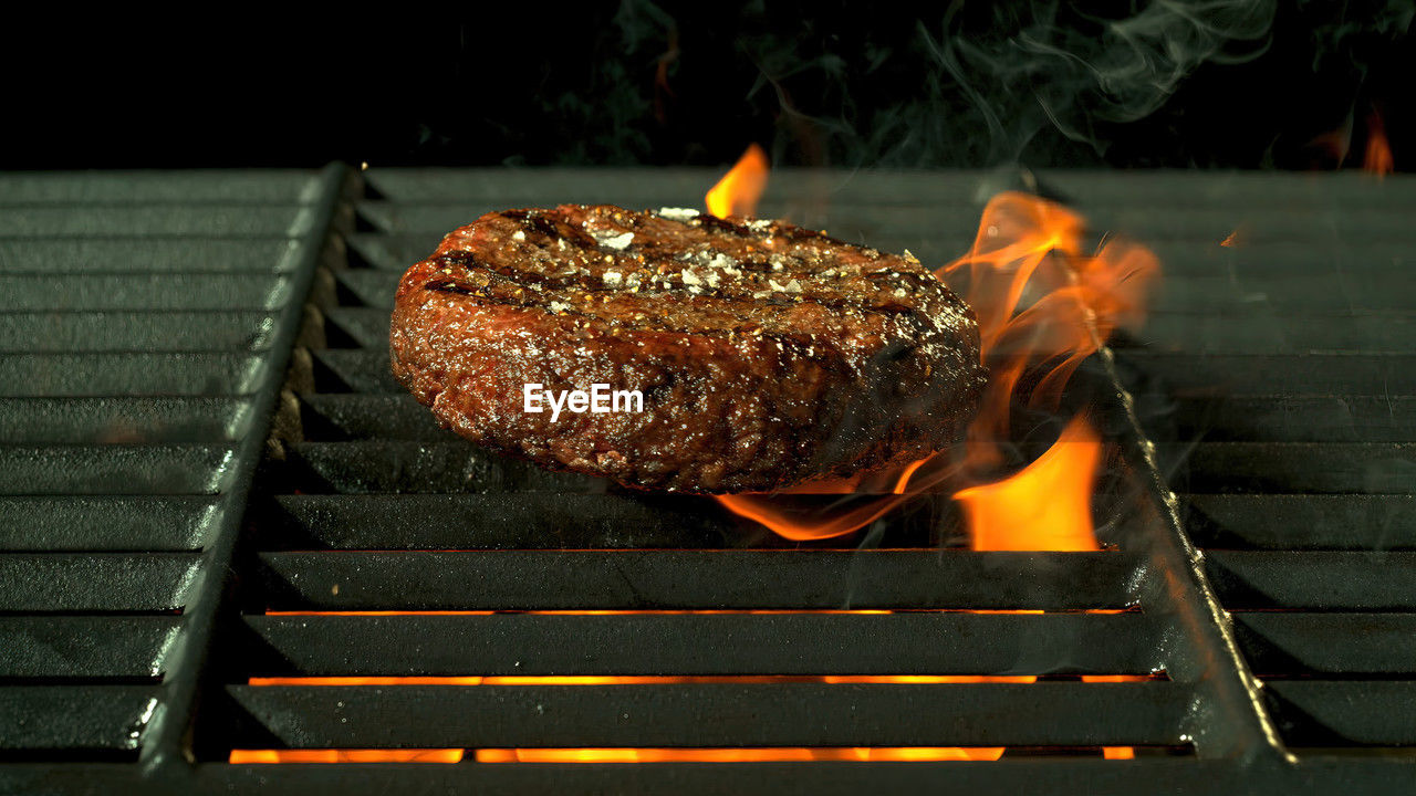 burning, fire, flame, heat, barbecue, barbecue grill, food, grilling, food and drink, grilled, meat, fast food, freshness, cooking, no people, coal, glowing, nature, outdoor grill, roasting, metal, iron, smoke, close-up, red meat, metal grate, grid, grate, outdoors