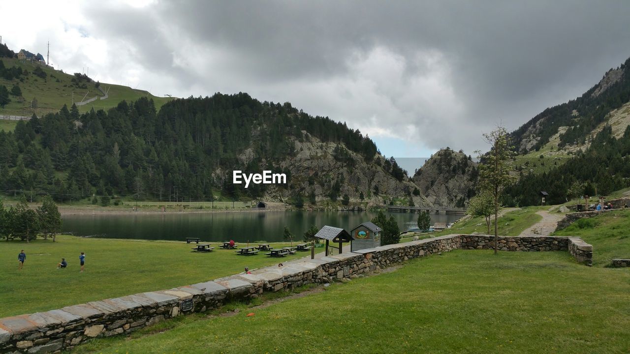 SCENIC VIEW OF LANDSCAPE AND MOUNTAINS AGAINST SKY