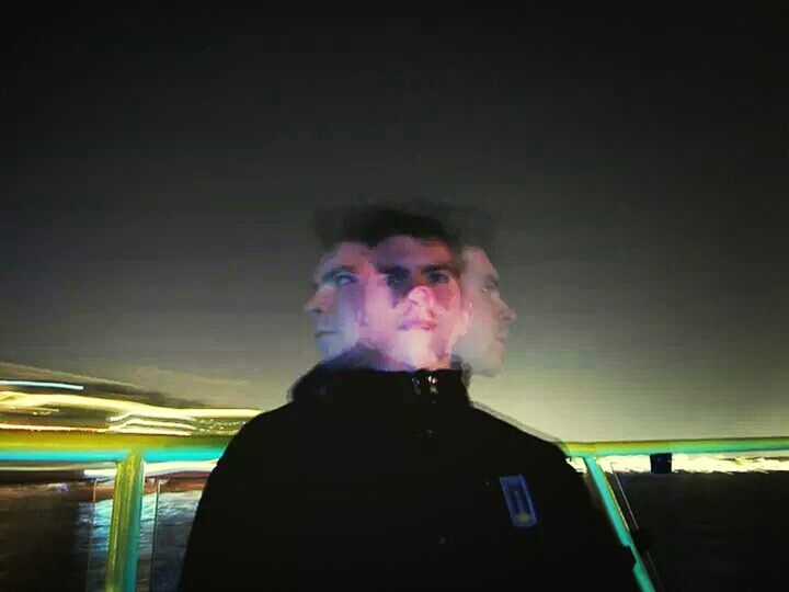 Digital composite image of young man at night