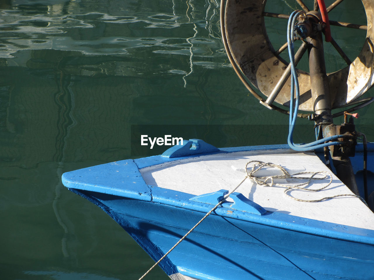 BOAT MOORED ON LAKE