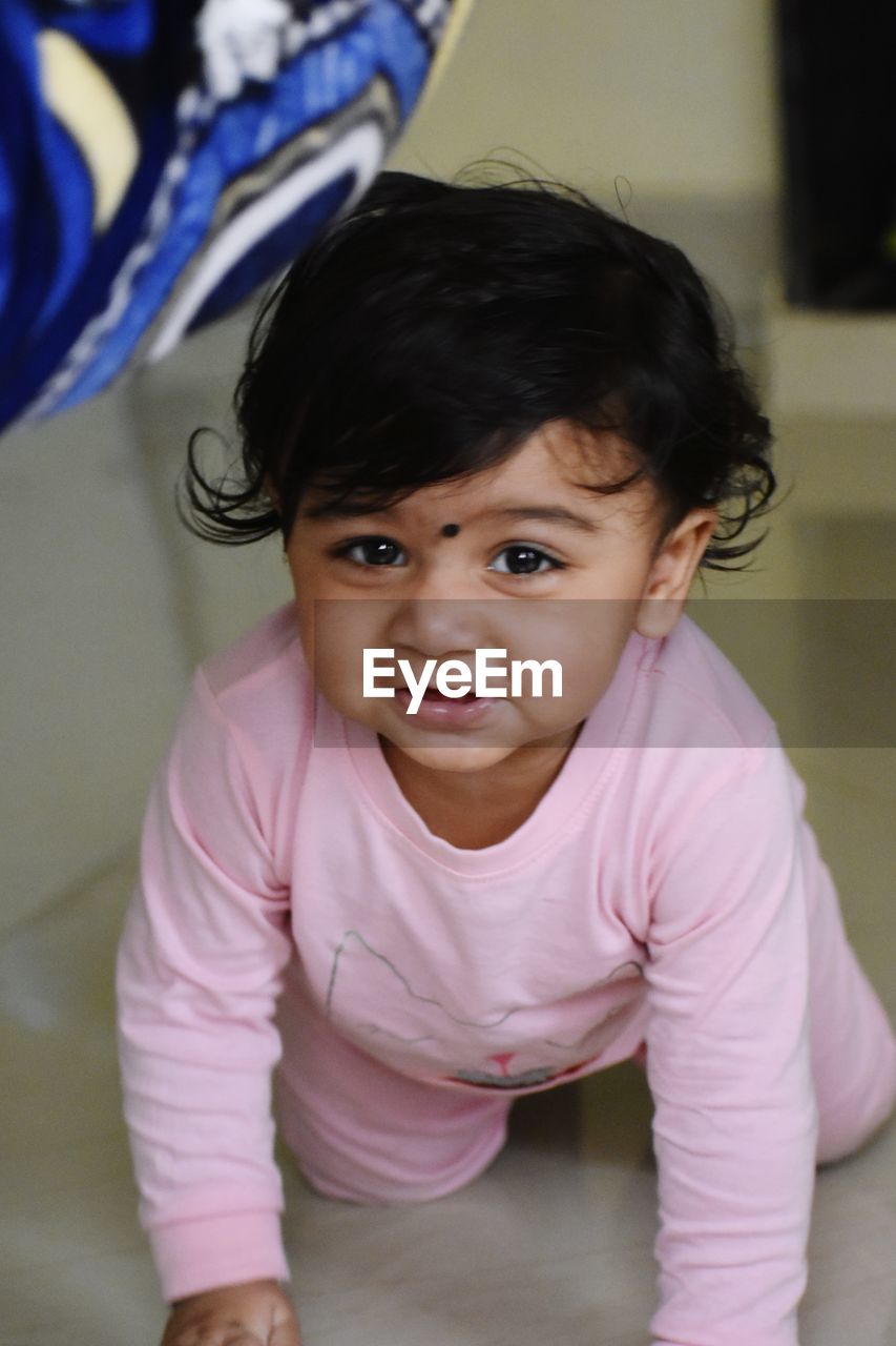 Cute baby girl at home