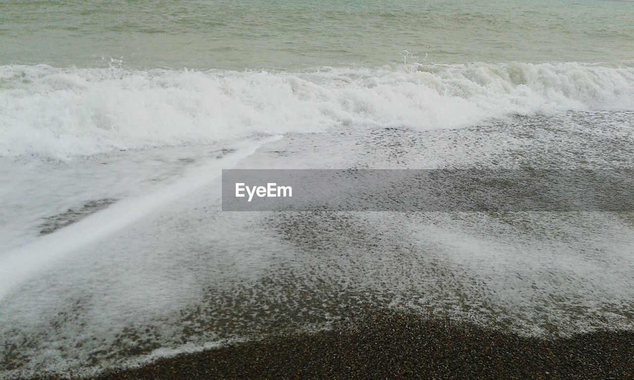 Waves splashing on beach