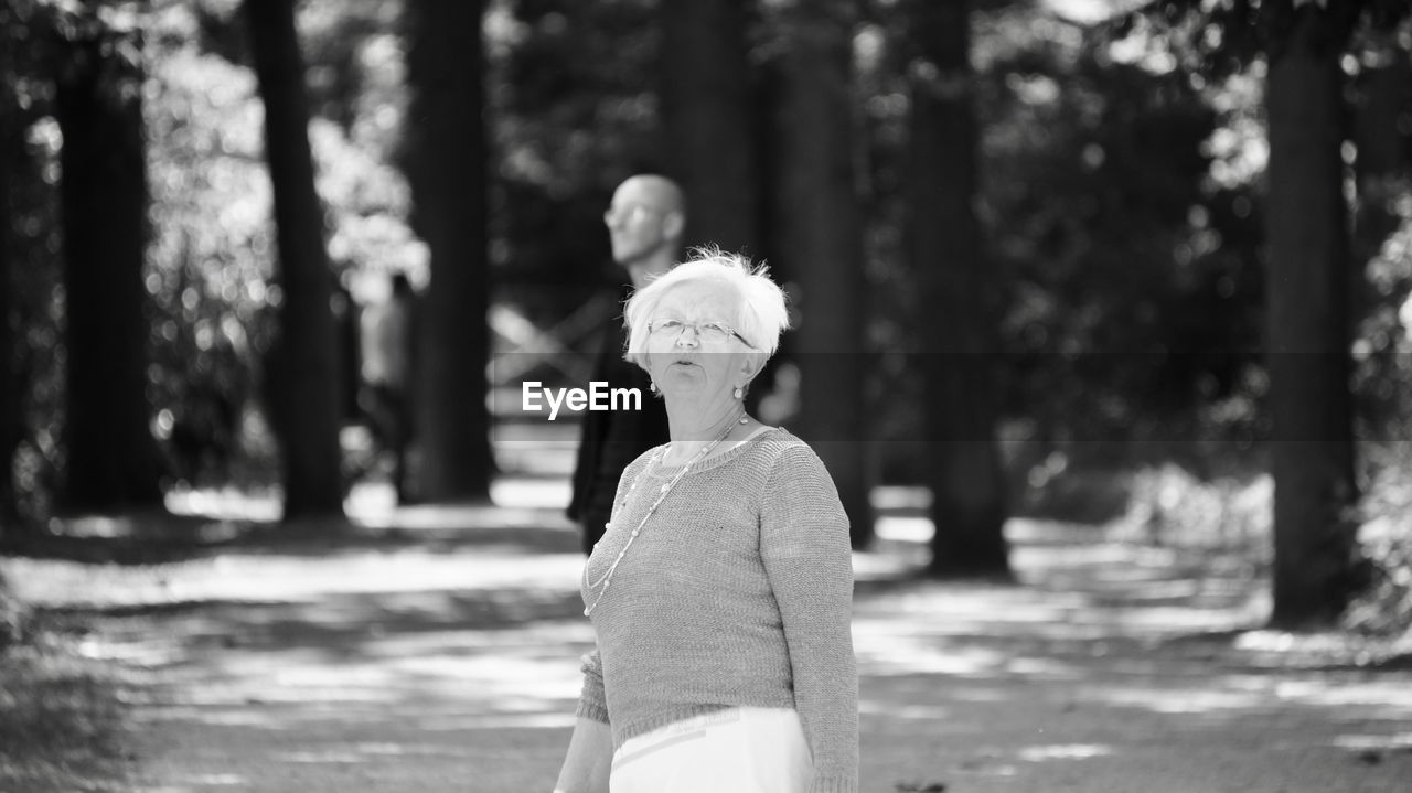 Senior woman standing in park