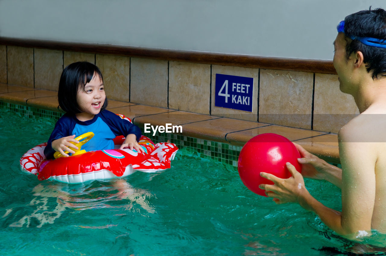 WOMAN IN SWIMMING POOL