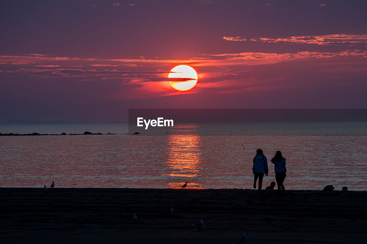 Warm summer sunrise over the ocean in new hampshire.