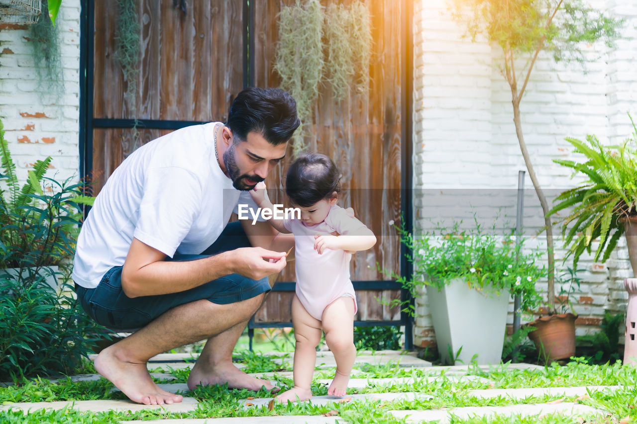 Father and child playing together at outdoor 