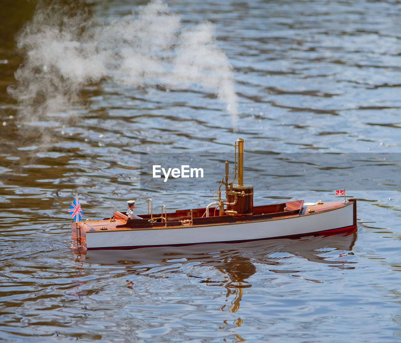Remote controlled ship model is remote controlled on a lake
