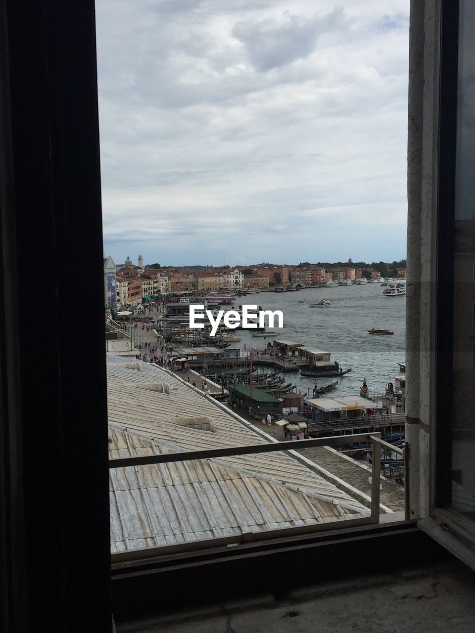 Grand canal by city seen through window