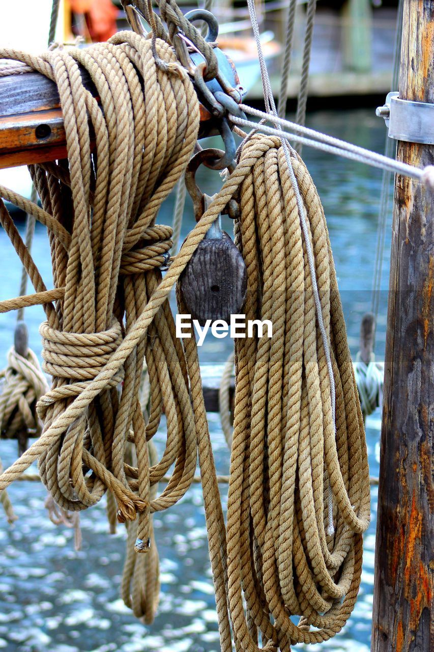 Close-up of rope tied to pole