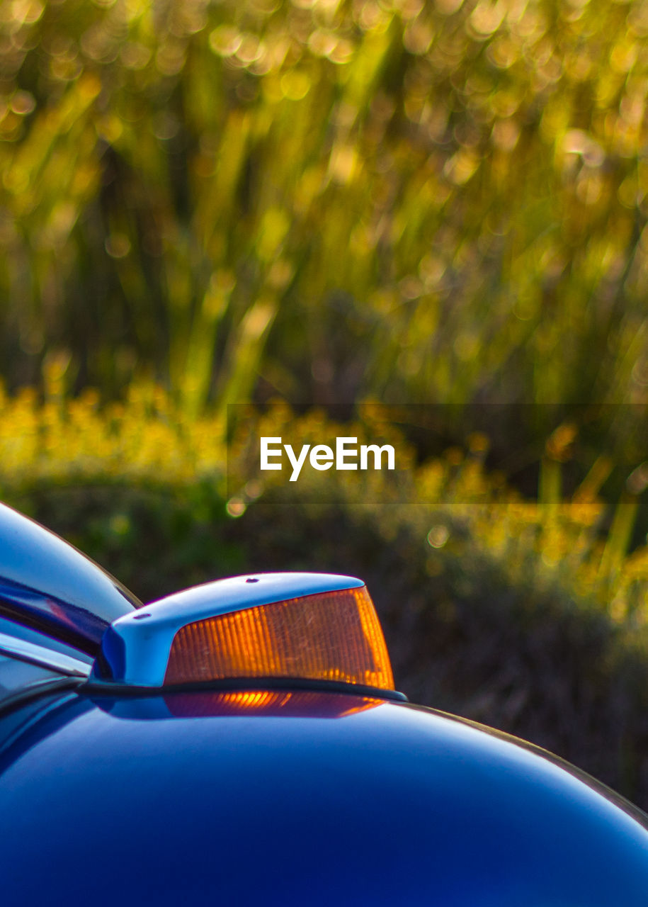 Close-up of blue vw beetle car indicator 