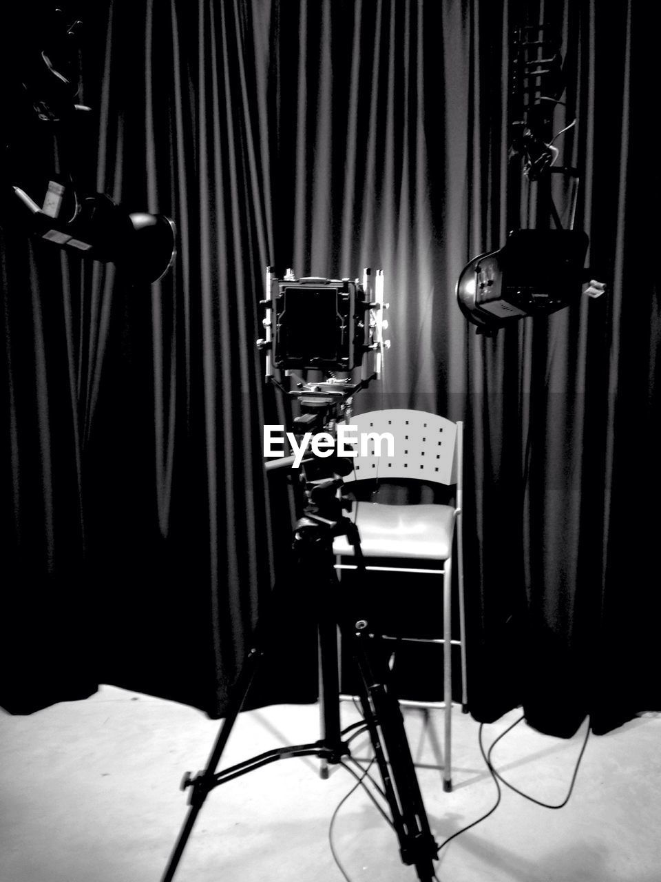 Light falling on empty chair in photo studio