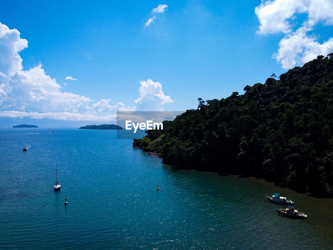 Scenic view of sea against blue sky