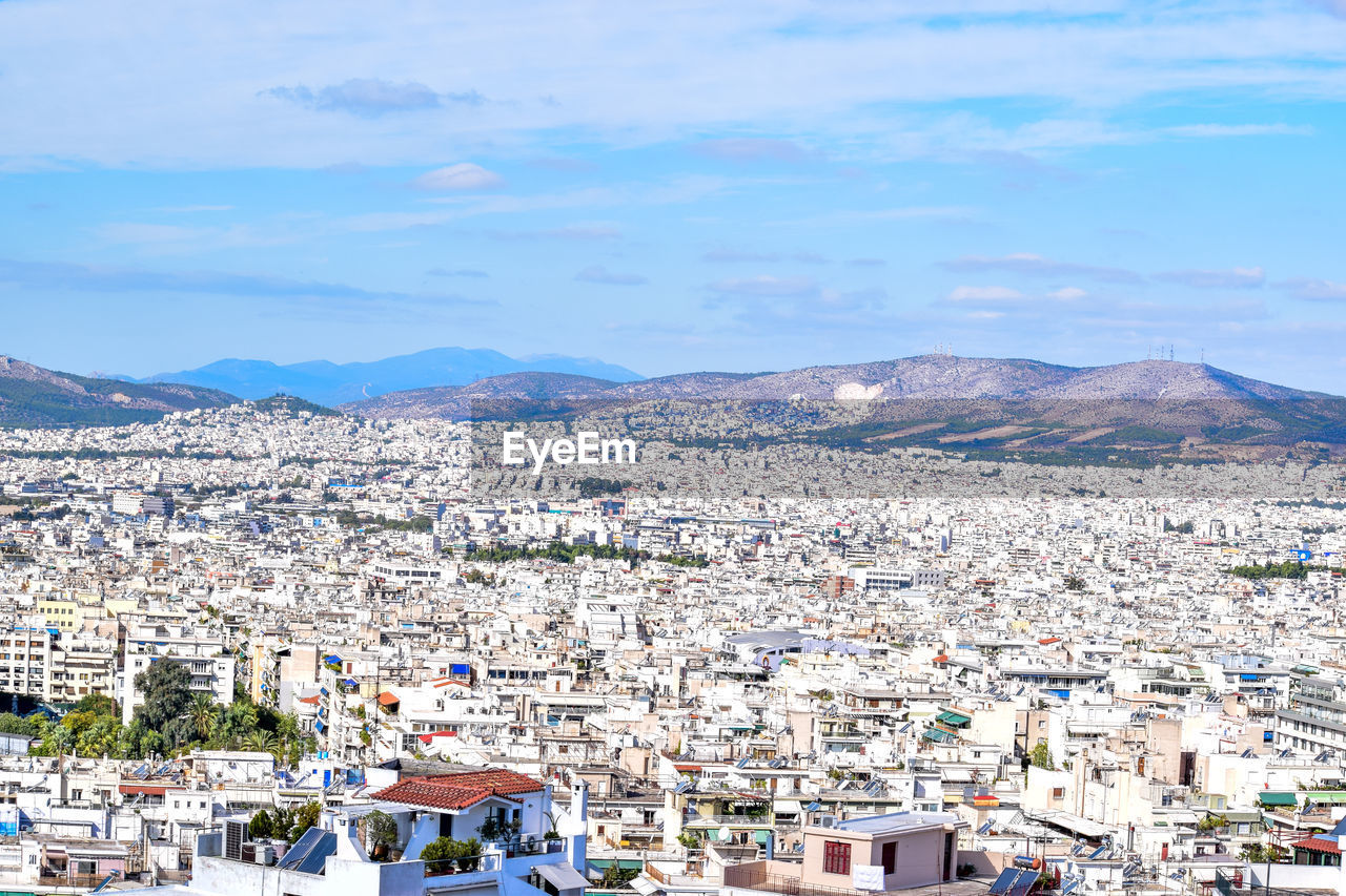 AERIAL VIEW OF PEOPLE ON MOUNTAIN AGAINST SKY