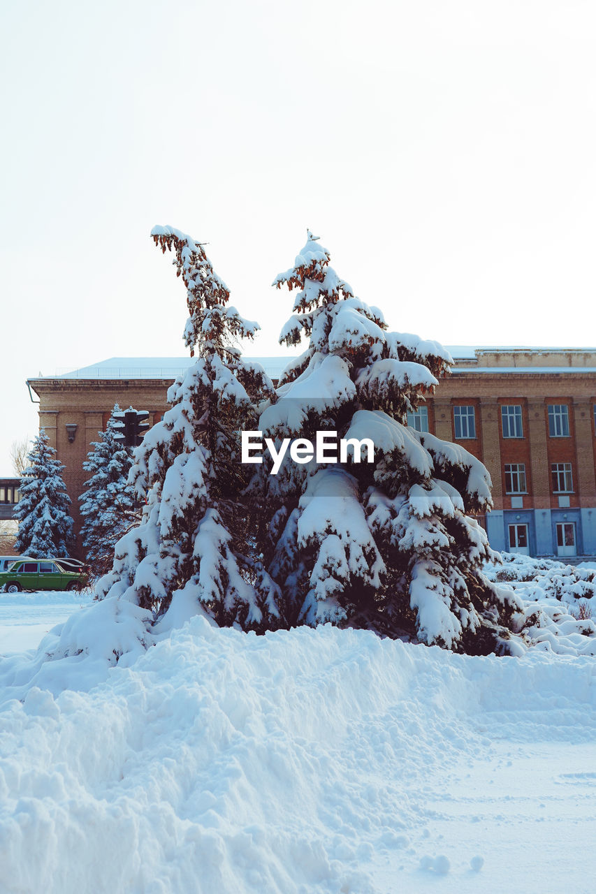 low angle view of snow covered mountain against clear sky