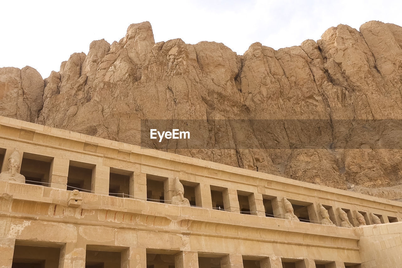 LOW ANGLE VIEW OF BUILT STRUCTURE ON MOUNTAIN