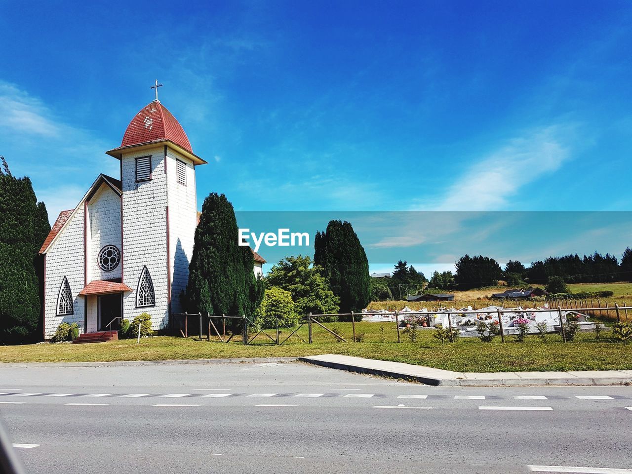 ROAD BY BUILDING AGAINST SKY