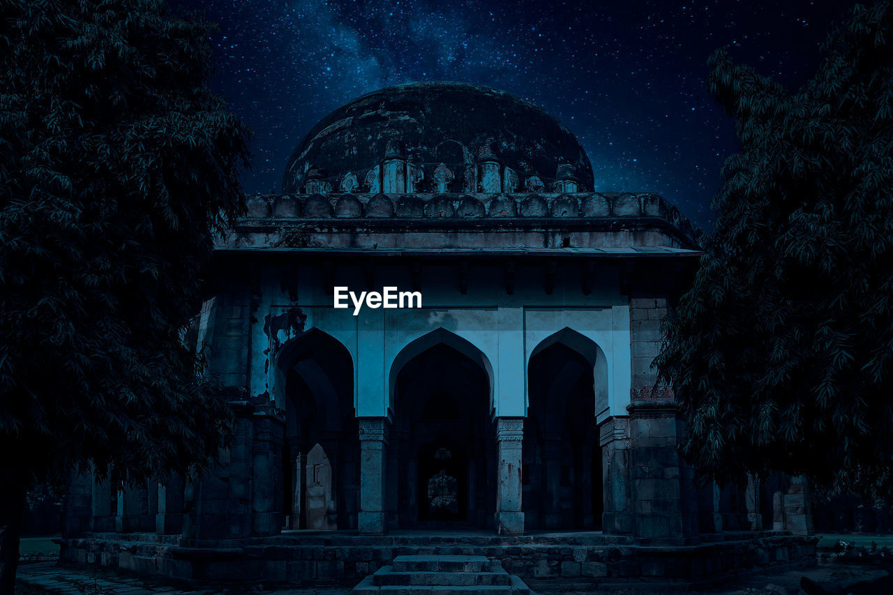 Low angle view of historical building against sky at night