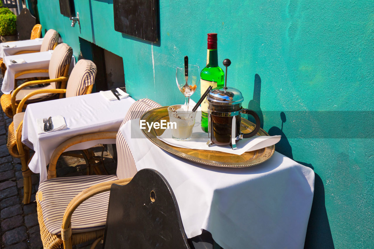 HIGH ANGLE VIEW OF BEER ON TABLE AT RESTAURANT