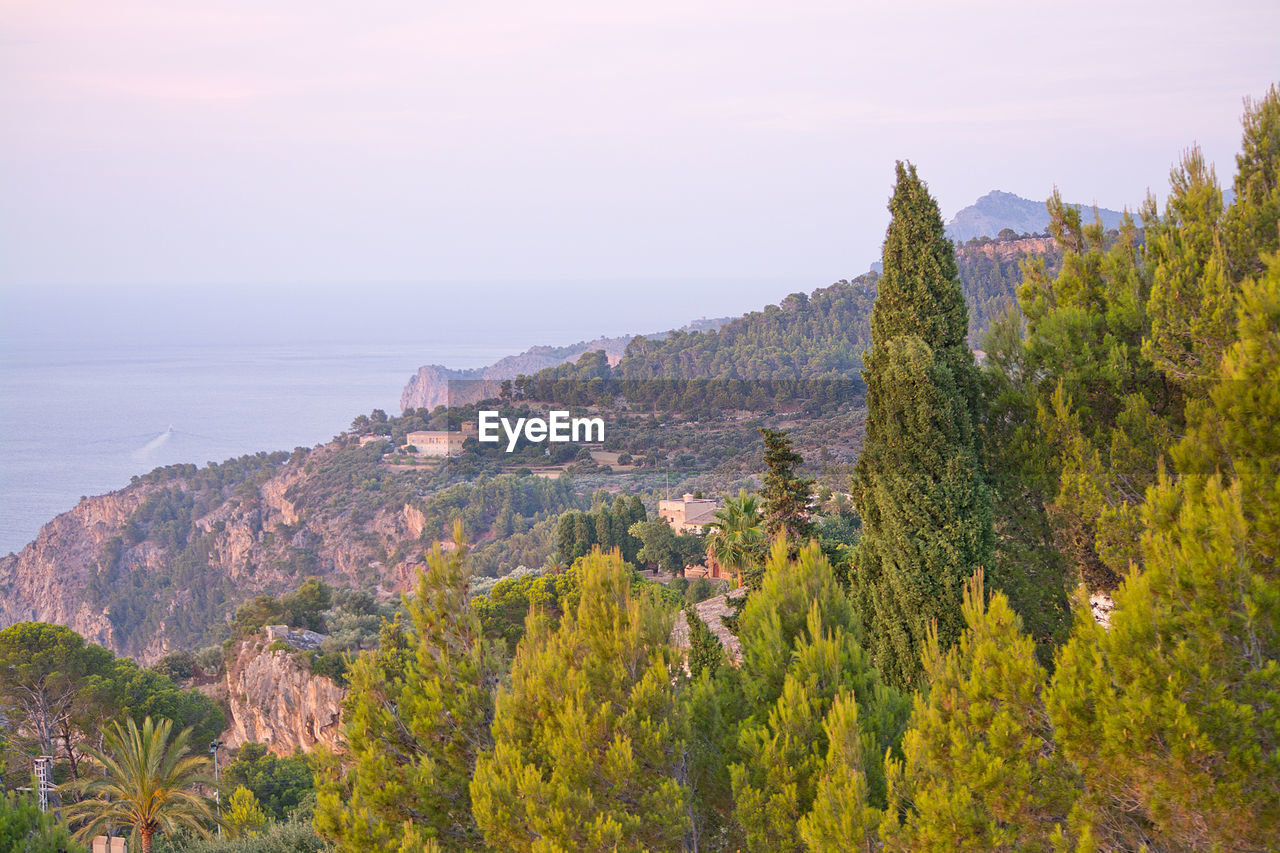 Panoramic view of sea and mountain against sky