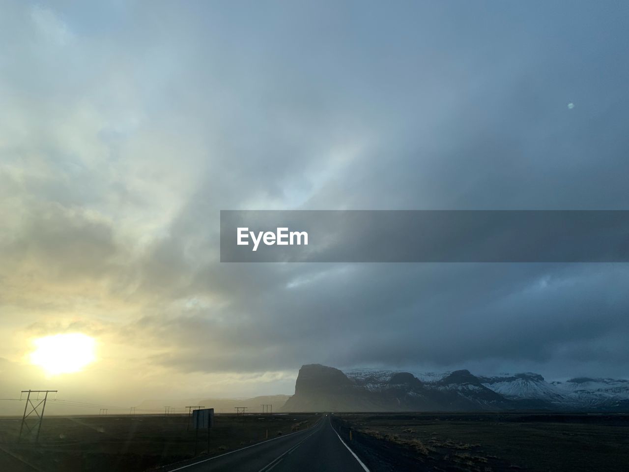 ROAD AGAINST SKY AT SUNSET