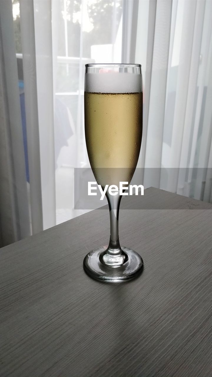 Close-up of champagne in glass on table