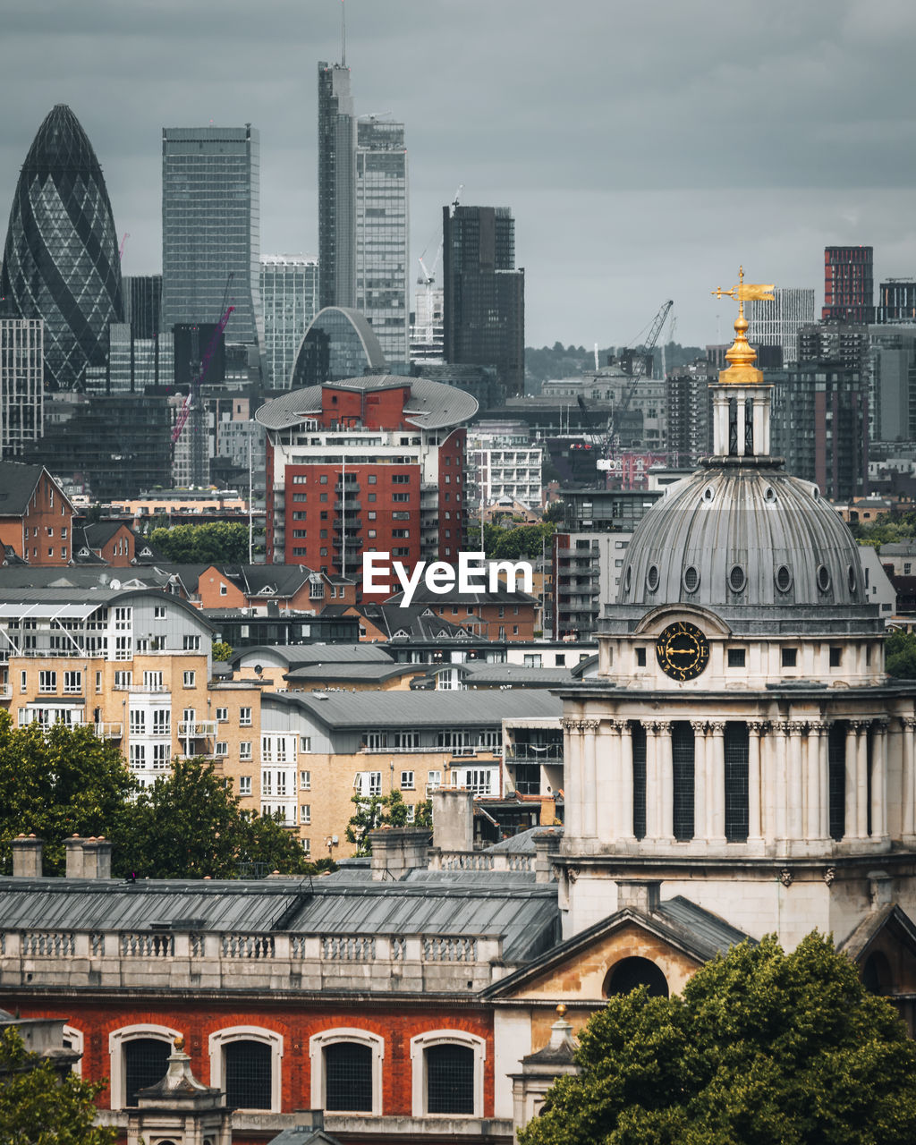 Buildings in city against sky