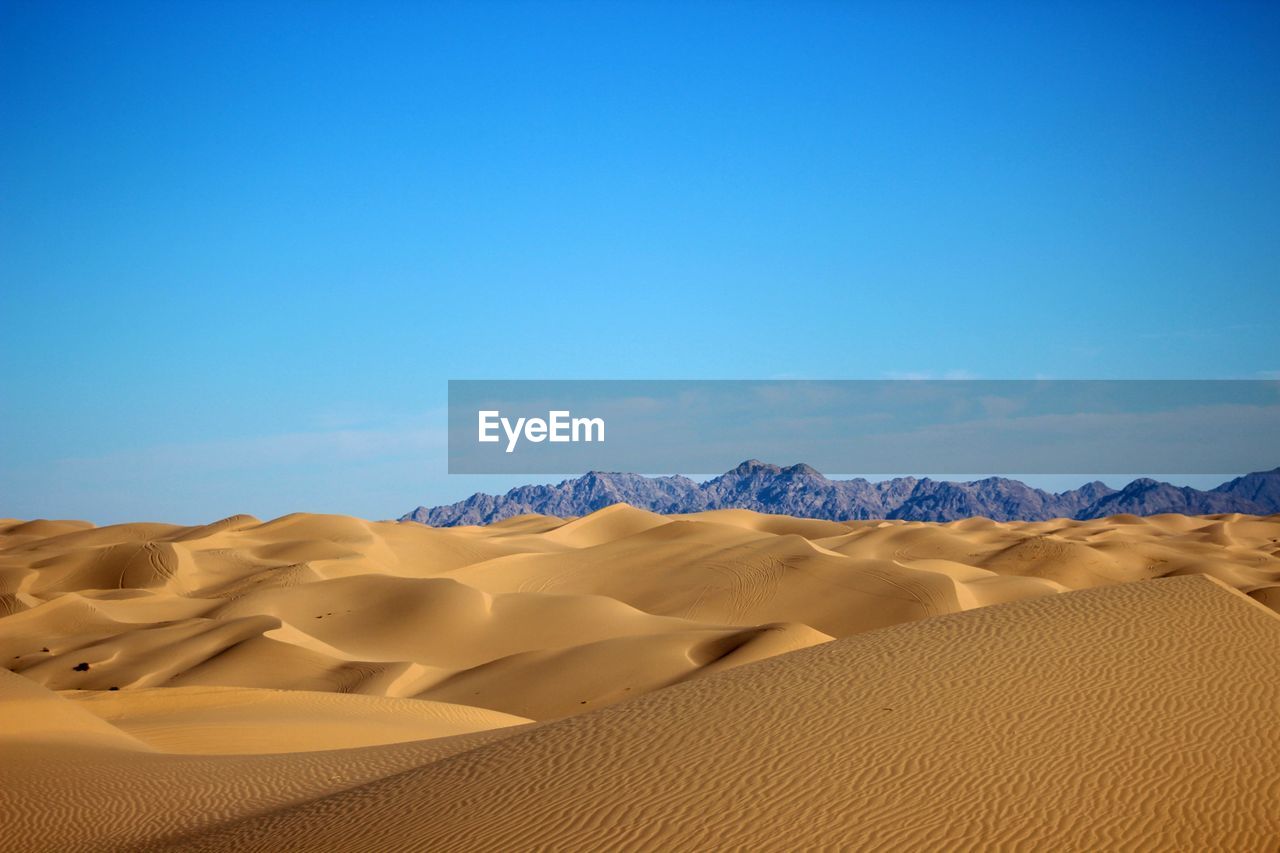 Desert against clear blue sky