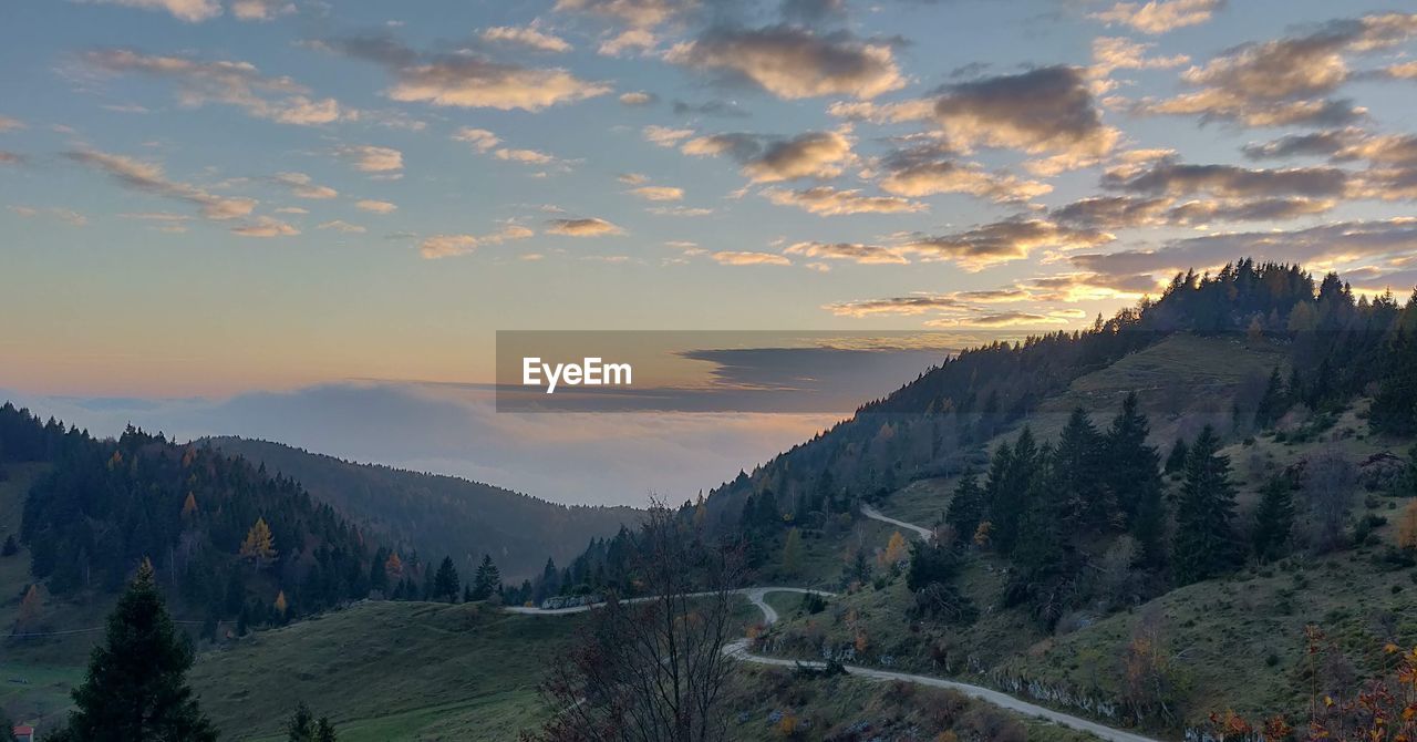 Scenic view of mountains against sky during sunset