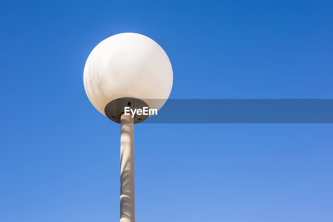 LOW ANGLE VIEW OF STREET LIGHT AGAINST SKY