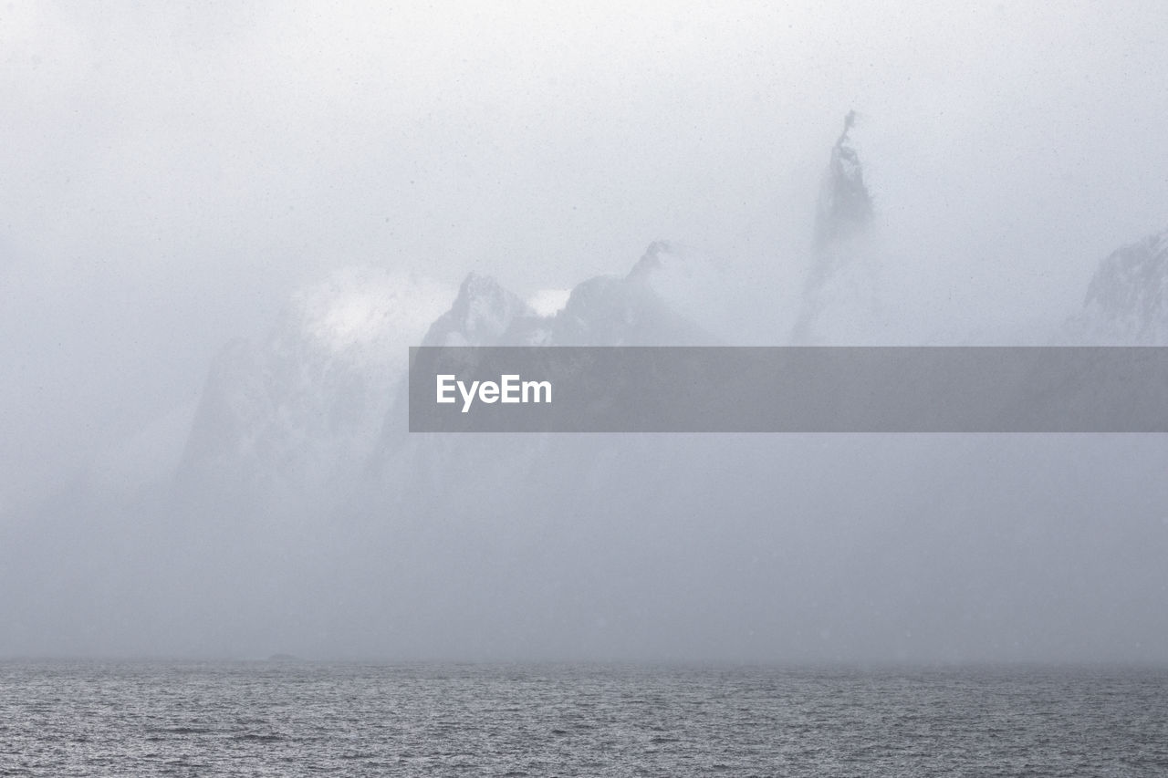 Scenic view of sea against sky during winter