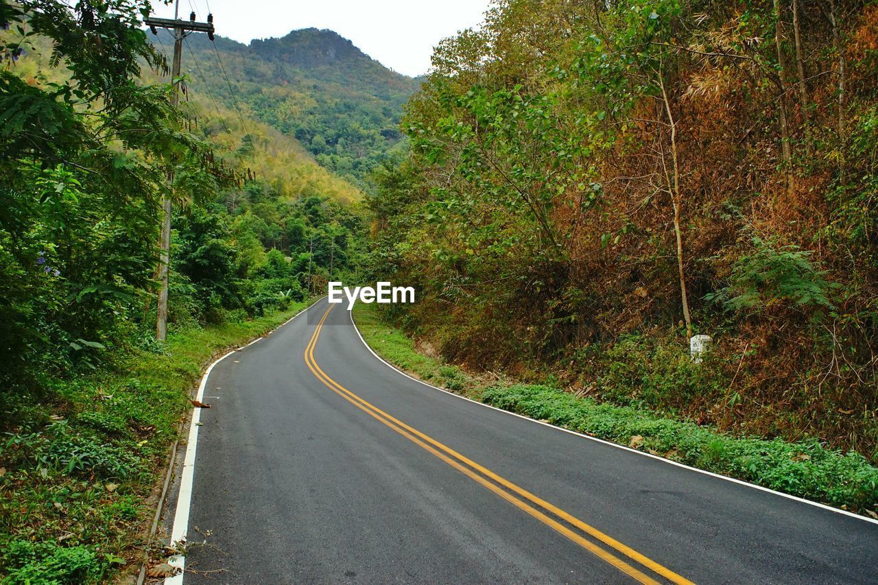 Empty road amidst mountains
