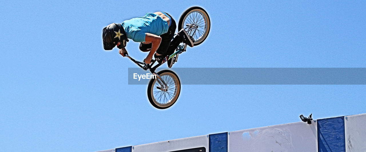 LOW ANGLE VIEW OF BICYCLE AGAINST SKY