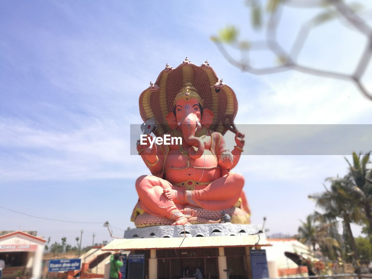 CLOSE-UP OF STATUE AGAINST SKY