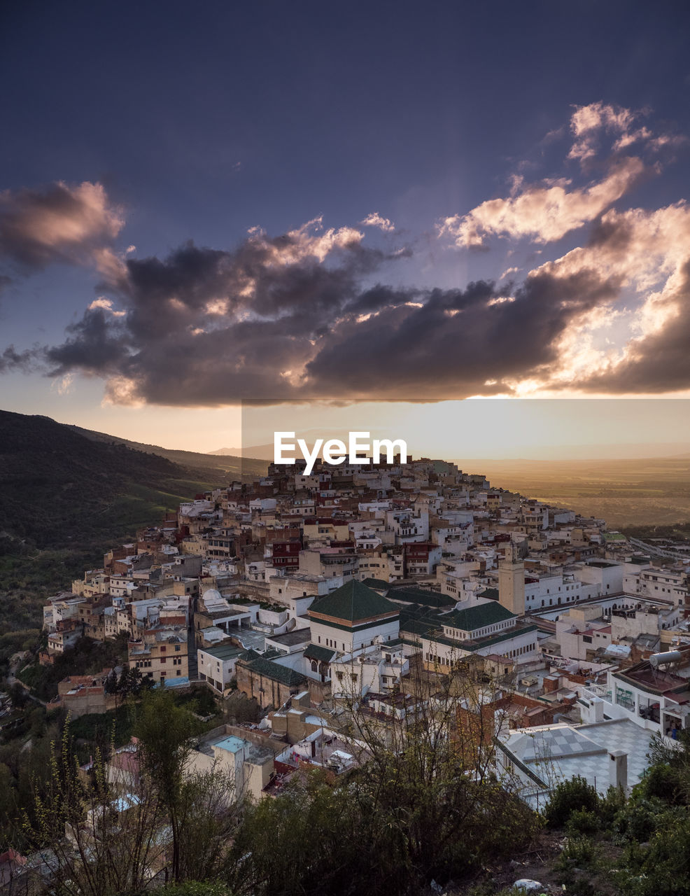 High angle shot of townscape against sky at sunset