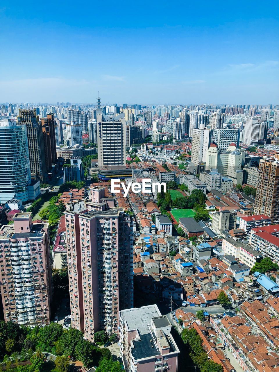 High angle view of modern buildings in city against sky