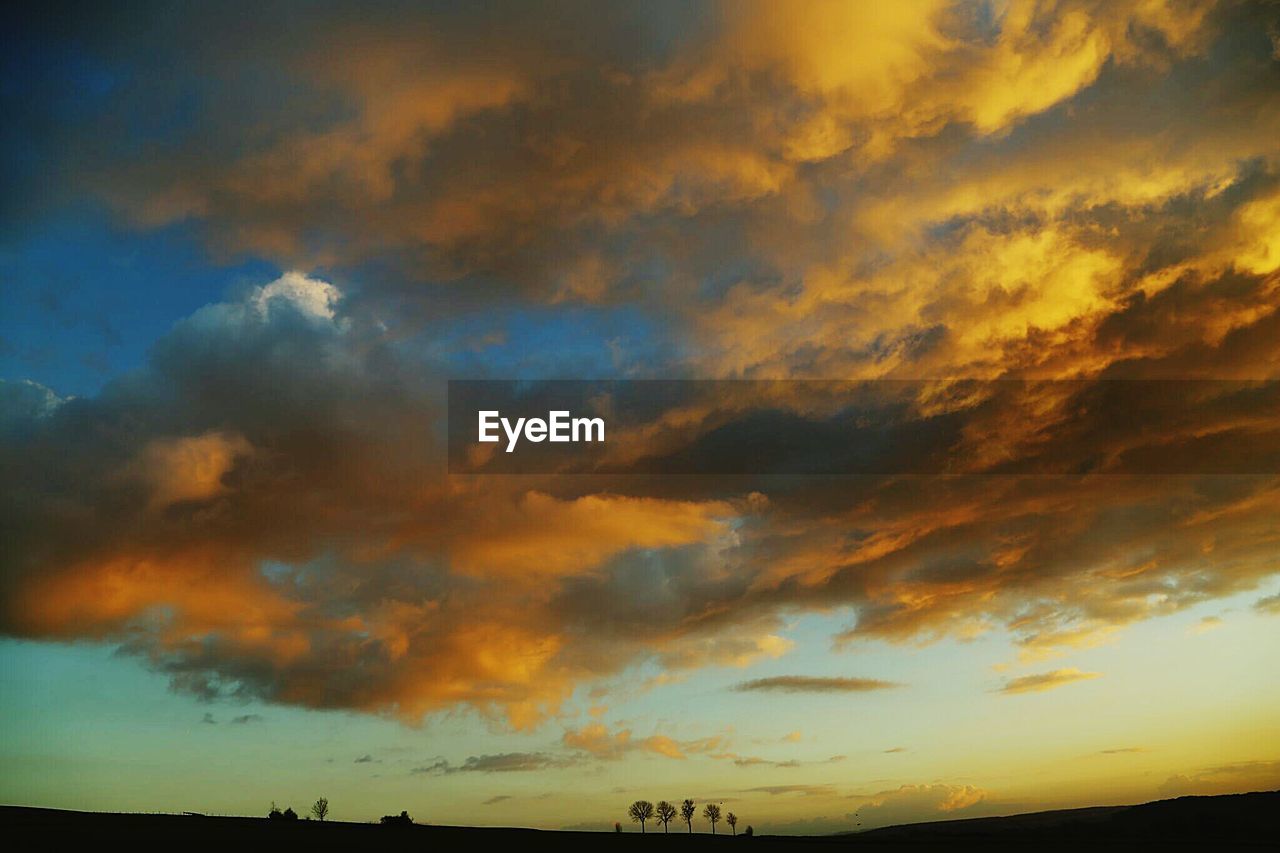 Low angle view of cloudy sky during sunset